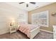 This bedroom features a ceiling fan and a wood accent wall at 117 Cove Pointe, Mount Holly, NC 28120