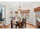 Inviting dining area with natural light, wood floors, and access to outdoor patio at 117 Cove Pointe, Mount Holly, NC 28120