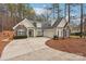 Traditional home with stone accents, shuttered windows, and mature landscaping at 117 Cove Pointe, Mount Holly, NC 28120