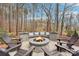 Inviting outdoor fire pit area with stone surround and built-in seating, perfect for relaxing evenings at 117 Cove Pointe, Mount Holly, NC 28120