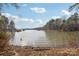 Scenic lake view with boats and docks, surrounded by lush greenery, offering a serene setting at 117 Cove Pointe, Mount Holly, NC 28120