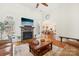 Spacious living room with stone fireplace, hardwood floors, and plenty of natural light at 117 Cove Pointe, Mount Holly, NC 28120