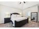 Spacious bedroom with neutral carpet, ceiling fan, and ensuite bathroom access at 117 Cove Pointe, Mount Holly, NC 28120