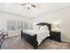 Bright main bedroom with neutral carpet, ceiling fan, and a large window at 117 Cove Pointe, Mount Holly, NC 28120