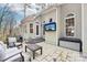 Outdoor patio with outdoor seating and mounted television at 117 Cove Pointe, Mount Holly, NC 28120