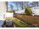 Small backyard with brick retaining wall at 121 Quality Dr, Mount Holly, NC 28120