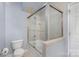 Bathroom with shower/tub combo and tile surround at 121 Quality Dr, Mount Holly, NC 28120