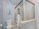 Bathroom with shower/tub combo and neutral tile at 121 Quality Dr, Mount Holly, NC 28120