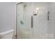 Clean bathroom with a large walk-in shower and pebble floor at 121 Quality Dr, Mount Holly, NC 28120