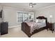 Bright bedroom with double bed, carpet flooring, and ceiling fan at 121 Quality Dr, Mount Holly, NC 28120