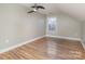 Simple bedroom with hardwood floors and a window at 121 Quality Dr, Mount Holly, NC 28120