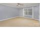 Bright bedroom with neutral walls and carpet at 121 Quality Dr, Mount Holly, NC 28120