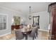 Elegant dining room with a large table and comfortable seating for six at 121 Quality Dr, Mount Holly, NC 28120