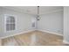 Simple dining room with hardwood floors and chandelier at 121 Quality Dr, Mount Holly, NC 28120