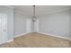 Dining room with hardwood floors and chandelier at 121 Quality Dr, Mount Holly, NC 28120