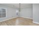 Simple dining room with hardwood floors and chandelier at 121 Quality Dr, Mount Holly, NC 28120