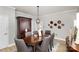 Elegant dining room with a large table and comfortable seating for six at 121 Quality Dr, Mount Holly, NC 28120