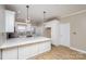 Modern kitchen with white cabinets, quartz countertops, and stainless steel appliances at 121 Quality Dr, Mount Holly, NC 28120