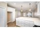 Modern kitchen with white cabinets, quartz countertops, and stainless steel appliances at 121 Quality Dr, Mount Holly, NC 28120