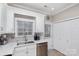 Modern kitchen with white cabinets, a double sink, and stainless steel appliances at 121 Quality Dr, Mount Holly, NC 28120