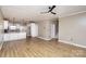 Spacious living room with hardwood floors, open to kitchen and upstairs access at 121 Quality Dr, Mount Holly, NC 28120