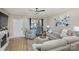 Spacious living room with light gray sofas, a Christmas tree, and a fireplace at 121 Quality Dr, Mount Holly, NC 28120