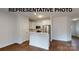 Open kitchen island in a modern home with hardwood floors at 1307 Signal Ave, Gastonia, NC 28052