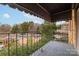 Cozy balcony with metal railing offering neighborhood views at 1323 Queens Rd # 312, Charlotte, NC 28207