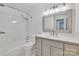 Bathroom featuring a stylish vanity with neutral-toned cabinets and a shower-tub combo at 1323 Queens Rd # 312, Charlotte, NC 28207