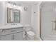 Bathroom featuring a modern vanity, toilet, and walk-in shower with tiled walls at 1323 Queens Rd # 312, Charlotte, NC 28207