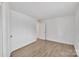 Clean and spacious bedroom features hard wood flooring and bright white walls at 1323 Queens Rd # 312, Charlotte, NC 28207