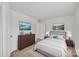 Nicely staged bedroom with a large bed, matching end tables, and artwork at 1323 Queens Rd # 312, Charlotte, NC 28207