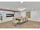 Well-lit dining area with a large table, seating for eight, and a decorative fireplace at 1323 Queens Rd # 312, Charlotte, NC 28207