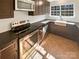 Modern kitchen with stainless steel appliances and dark cabinetry at 13943 Dannemara Dr, Pineville, NC 28134