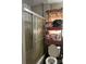 Bathroom with bathtub, shower, and shelving unit at 1401 Chelveston Dr, Charlotte, NC 28208