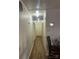 Long hallway with light walls and hardwood floors at 1401 Chelveston Dr, Charlotte, NC 28208