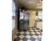 Kitchen with stainless steel refrigerator and black and white checkered floor at 1401 Chelveston Dr, Charlotte, NC 28208