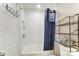 Simple bathroom with a shower/tub combo and white tile at 1605 Merry Oaks Rd # E, Charlotte, NC 28205