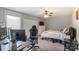 Bedroom with a double bed, desk, and gaming chair at 1605 Merry Oaks Rd # E, Charlotte, NC 28205