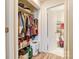 Large closet with shelving, hanging rods, and bathroom access at 1605 Merry Oaks Rd # E, Charlotte, NC 28205