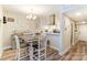 Charming dining area with a table and chairs, adjacent to the kitchen at 1605 Merry Oaks Rd # E, Charlotte, NC 28205