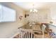 Bright dining area with table and chairs, and a home bar at 1605 Merry Oaks Rd # E, Charlotte, NC 28205