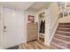 Bright condo entryway with coat closet and stairs at 1605 Merry Oaks Rd # E, Charlotte, NC 28205