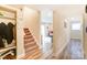 Light and bright entryway with stairs and coat closet at 1605 Merry Oaks Rd # E, Charlotte, NC 28205