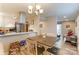 Open concept kitchen with a breakfast bar and view of living area at 1605 Merry Oaks Rd # E, Charlotte, NC 28205