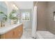 Stylish bathroom features dual sinks, elegant mirrors, and a shower-tub combo with tiled walls at 2100 Knickerbocker Dr, Charlotte, NC 28212