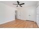 This is a bedroom featuring hardwood floors, a ceiling fan, and a closet at 2100 Knickerbocker Dr, Charlotte, NC 28212