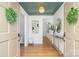 Inviting foyer with hardwood floors, a decorative ceiling, stylish console table, and elegant decor at 2100 Knickerbocker Dr, Charlotte, NC 28212