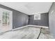 Unfinished basement room with grey walls and vinyl flooring at 2209 Donnabrook Ln, Gastonia, NC 28052