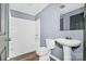 Bathroom with white pedestal sink, tub, and shower at 2209 Donnabrook Ln, Gastonia, NC 28052